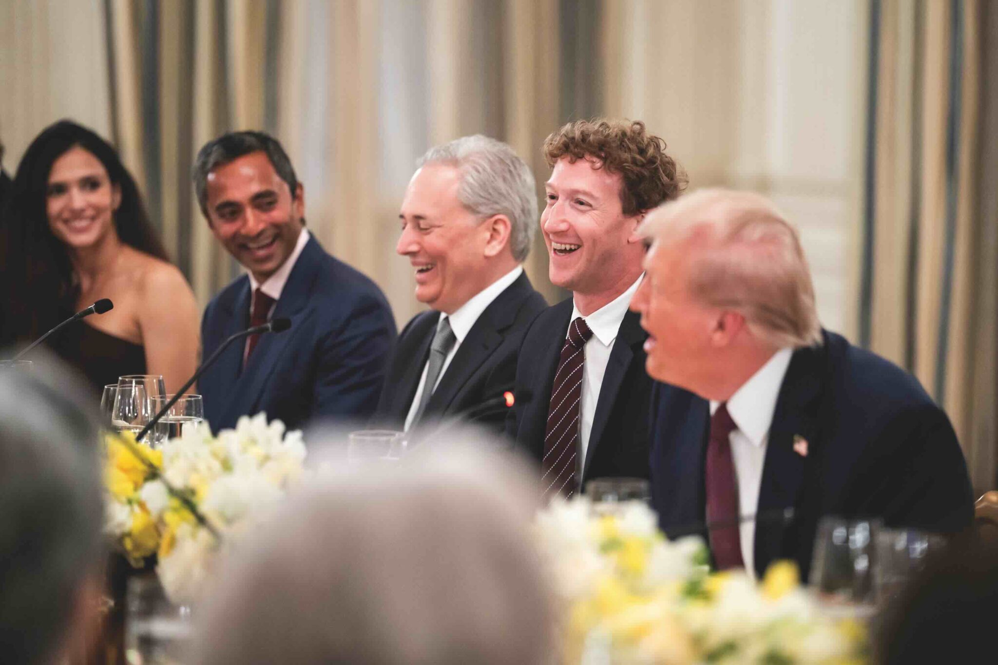 Happy billionaire donors enjoying a dinner with the president of the United States